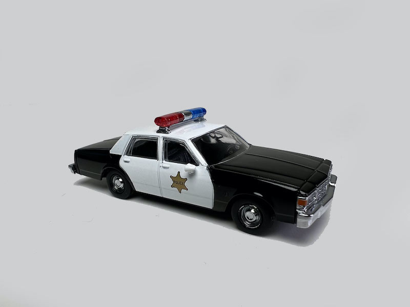 Rapido 800010 - HO Scale 1980-1985 Chevrolet Impala Sedan - Assembled - Police (Black/White)